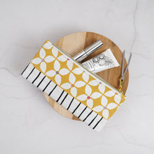 Load image into Gallery viewer, Yellow and white patterned pouch with cosmetic items on a wooden round tray Athena Pencil Case Sewing Pattern PDF