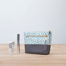 Load image into Gallery viewer, Patterned pouch with gray bottom on a wooden surface Ayla Zipper Pouch Sewing Pattern PDF