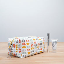 Load image into Gallery viewer, Patterned toiletry bag on a wooden surface with a light gray background Demi Boxy Bag Sewing Pattern PDF