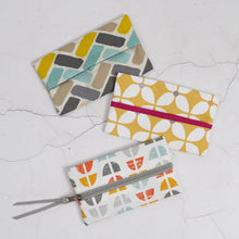Load image into Gallery viewer, Three patterned pouches on a textured white surface Keya Tissue Pouch PDF Sewing Pattern