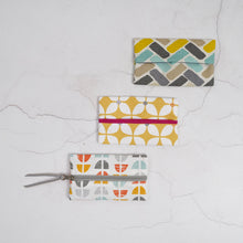 Load image into Gallery viewer, Three patterned pouches on a textured white surface Keya Tissue Pouch PDF Sewing Pattern