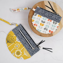 Load image into Gallery viewer, Two fabric pouches with geometric patterns on a white surface. Lexi Wristlet Sewing Pattern PDF