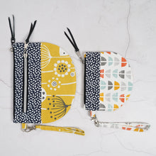 Load image into Gallery viewer, Two patterned pouches with zippers on a textured white surface Lexi Wristlet Sewing Pattern PDF
