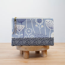 Load image into Gallery viewer, Fabric pouch with floral pattern on a wooden stand against a light background Luna Zipper Pouch Sewing Pattern PDF