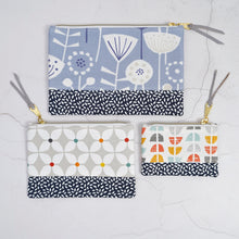 Load image into Gallery viewer, Four fabric pouches with different patterns on a light gray background Luna Zipper Pouch Sewing Pattern PDF