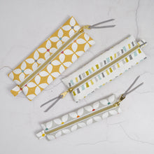 Load image into Gallery viewer, Three fabric pouches with zipper on a light gray background Mina Pencil Case Sewing Pattern PDF