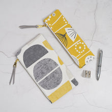 Load image into Gallery viewer, Two patterned pouches with a pen and sharpener on a textured surface Tasnim Pencil Case Sewing Pattern PDF
