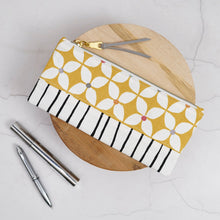 Load image into Gallery viewer, Fabric pouch with geometric pattern on a wooden block with pens on a light gray background
