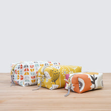 Load image into Gallery viewer, Three fabric pouches with different patterns on a wooden surface. pfd sewing pattern Molko Studios
