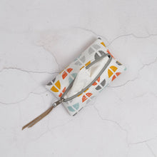 Load image into Gallery viewer, Fabric pouch with geometric pattern on a textured white surface 
