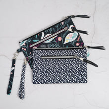 Load image into Gallery viewer, Set of three patterned pouches with zippers on a light gray surface Lena Wristlet Sewing Pattern PDF

