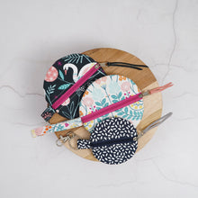 Load image into Gallery viewer, Set of fabric pouches with zippers on a wooden board Naima Circle Coin Purse Sewing Pattern PDF
