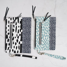 Load image into Gallery viewer, Two patterned bags with zippers on a light gray background Ria Wristlet Sewing Pattern PDF
