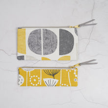 Load image into Gallery viewer, Two fabric pouches with geometric patterns on a textured white surface Tasnim Pencil Case Sewing Pattern PDF
